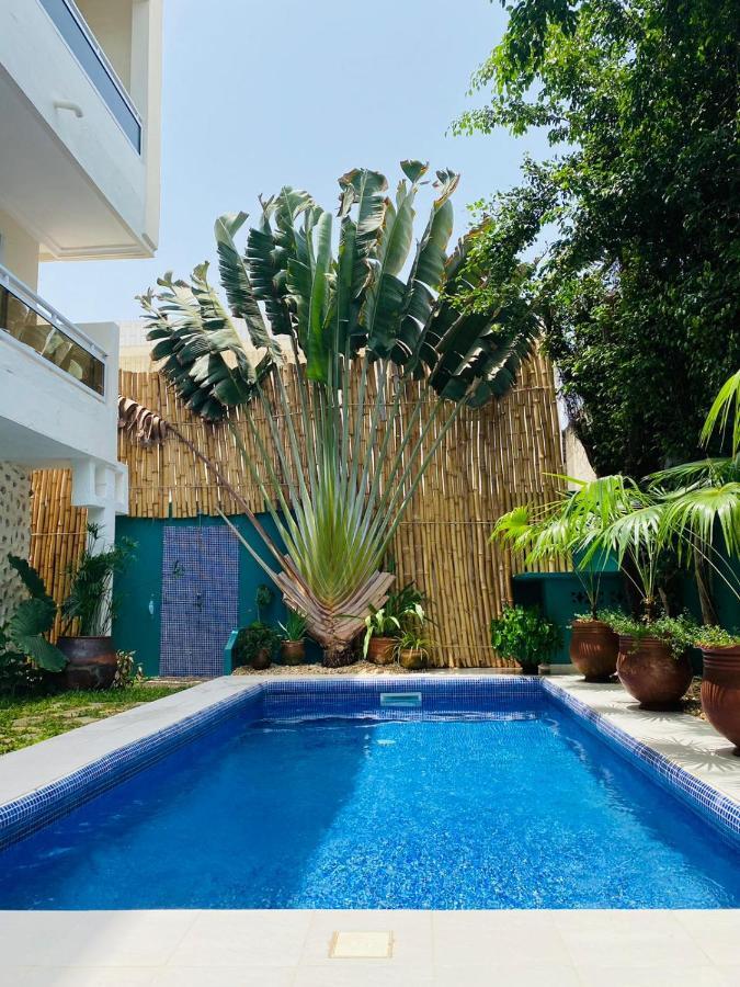 L'Oasis Guesthouse Котону Экстерьер фото