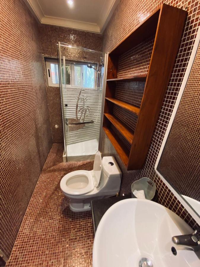 L'Oasis Guesthouse Котону Экстерьер фото