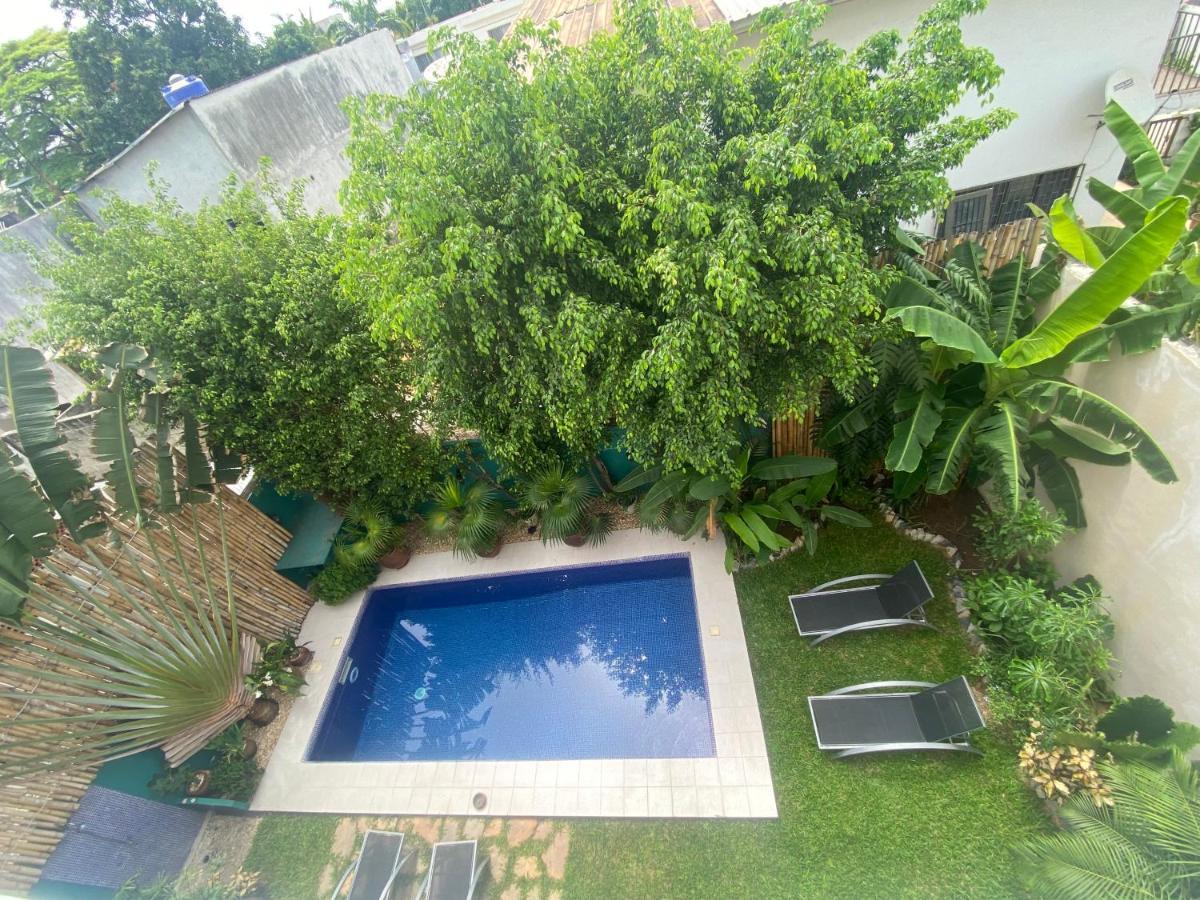 L'Oasis Guesthouse Котону Экстерьер фото