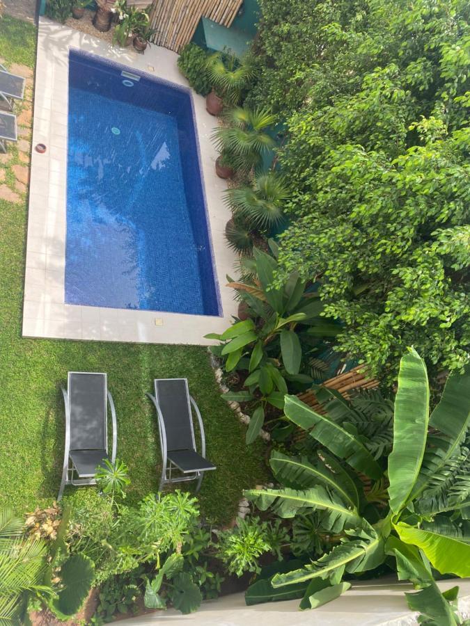 L'Oasis Guesthouse Котону Экстерьер фото
