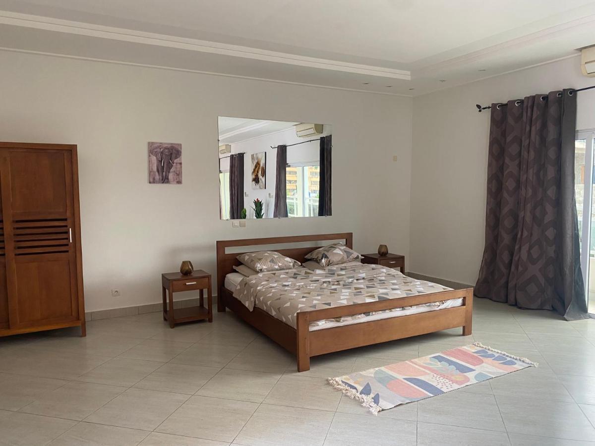 L'Oasis Guesthouse Котону Экстерьер фото
