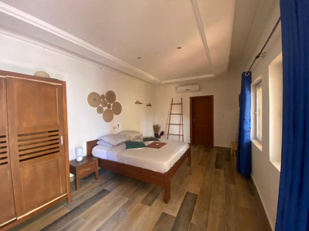 L'Oasis Guesthouse Котону Экстерьер фото