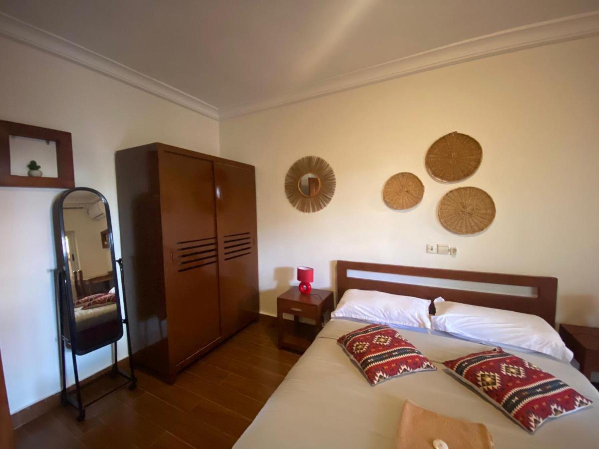L'Oasis Guesthouse Котону Экстерьер фото