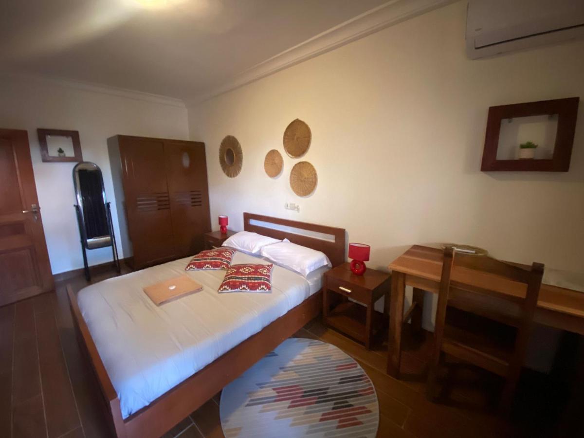 L'Oasis Guesthouse Котону Экстерьер фото